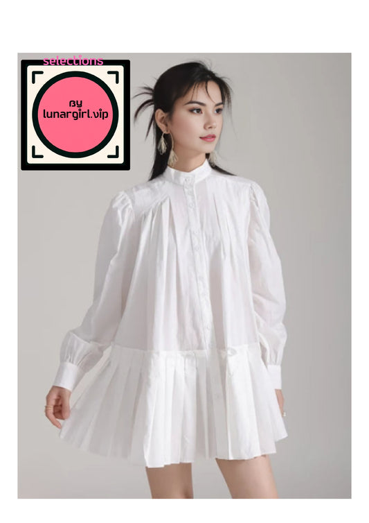 The white oversized shirt dress is a versatile and stylish piece that combines classic elements with modern design features, characterized by its loose and relaxed fit, making it a comfortable and chic addition to any wardrobe.
The shirt features a classic collar, which adds a touch of formality and structure to the otherwise relaxed silhouette. The neckline is traditional, with a button-up front that allows for adjustable styling.
The long sleeves are designed with buttoned cuffs, which can be rolled up fo